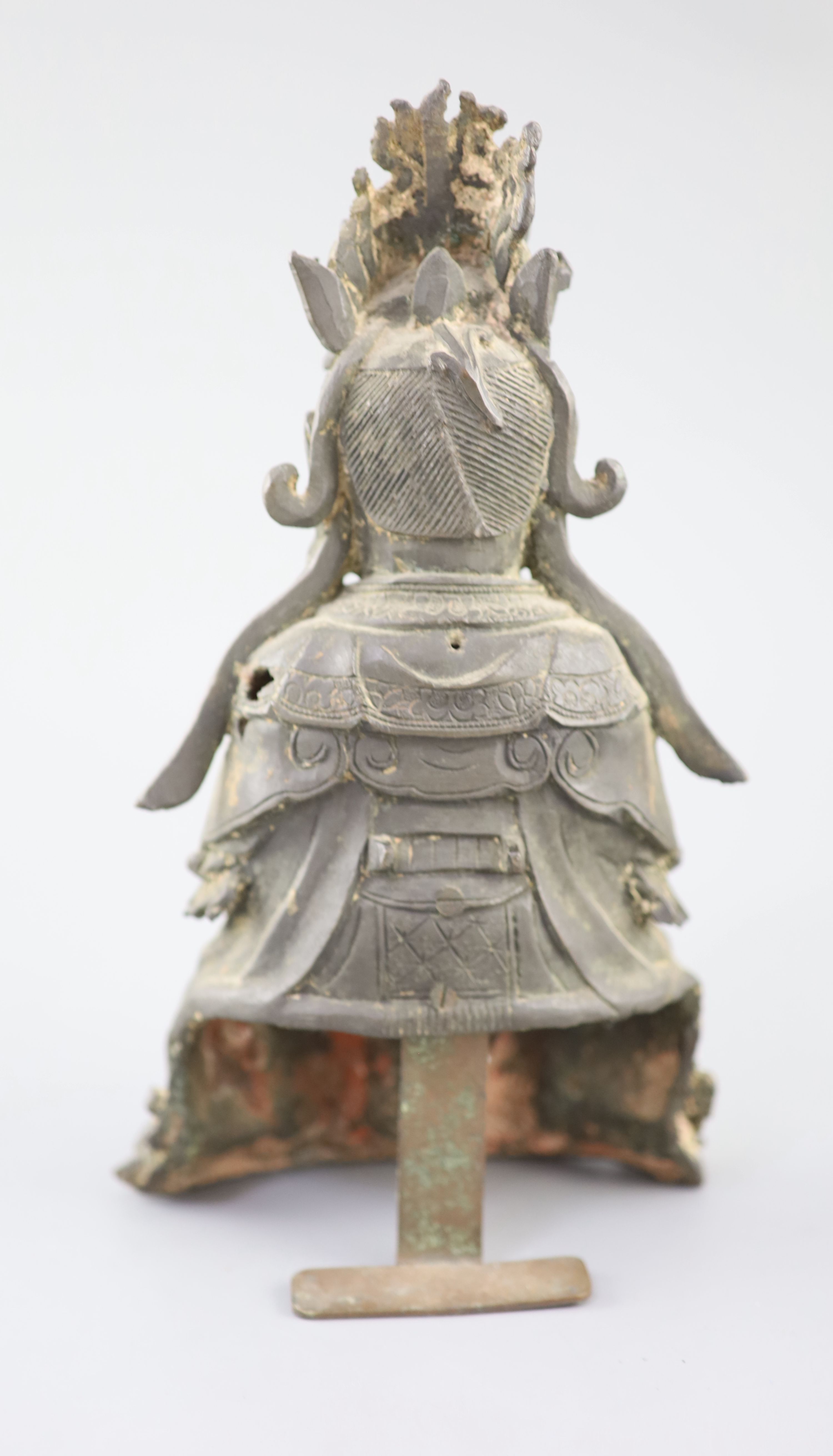 A Chinese bronze seated figure of Xi Wangmu, Queen Mother of the West, 15th/16th century, Ming Dynasty, 26.5cm high, small losses and l